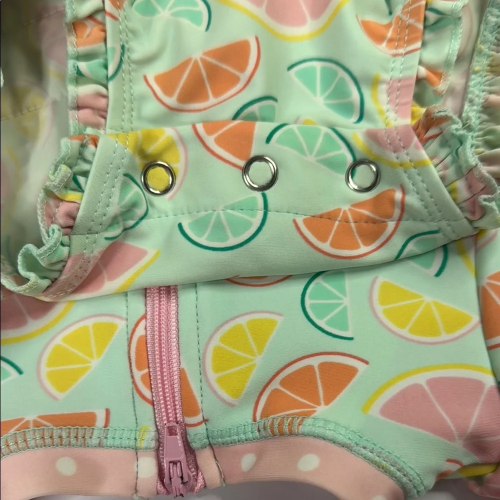 Ruffle Butts Baby Girls Squeeze The Day Pink and Green Citrus One Piece Swimsuit